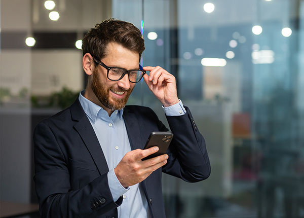 Man on phone in busy office
