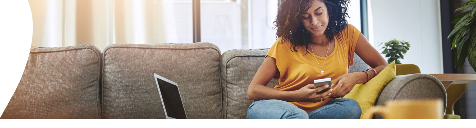 woman-looking-at-phone-on-sofa
